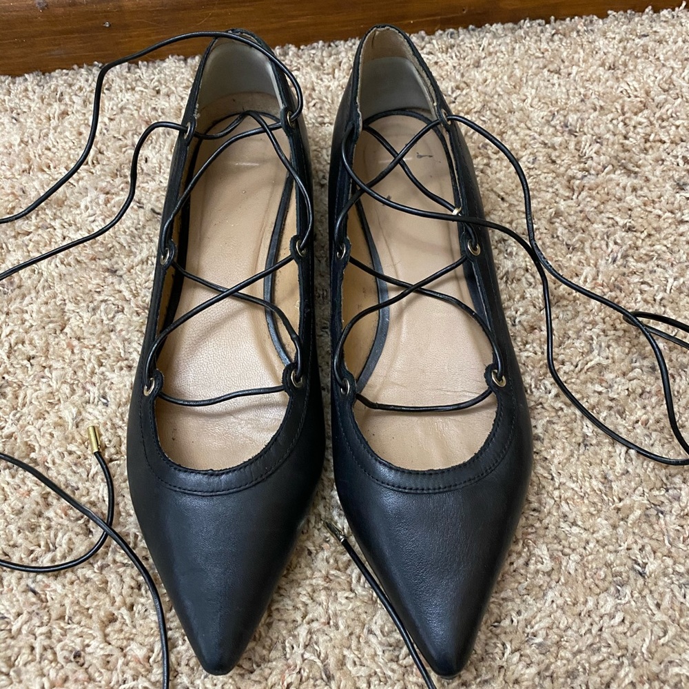 Black and gold lace up ballet flat shoes